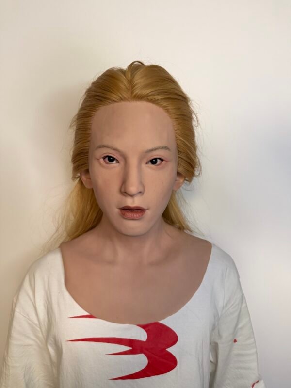 Adam realistic silicone female mask with blonde hair and chest plate front view