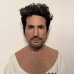 Alex ultra-realistic male silicone mask with styled wavy black hair and trimmed beard for disguise and film FX