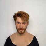 John realistic silicone male mask with styled brown hair and beard front view